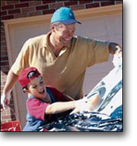 Roofer washing his car.